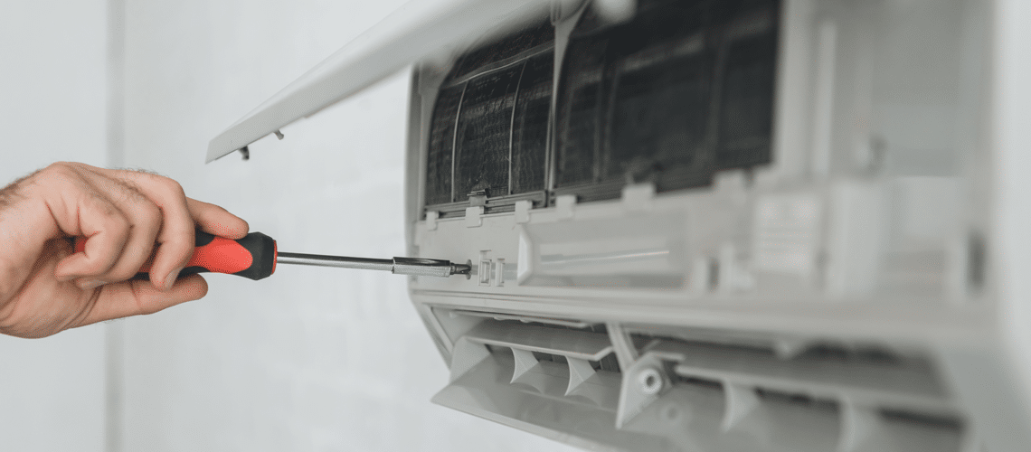 a hand doing an Air conditioner repair
