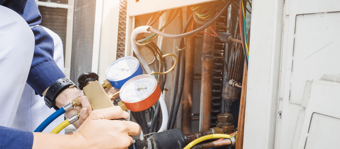 technician making a commercial air conditioning repair