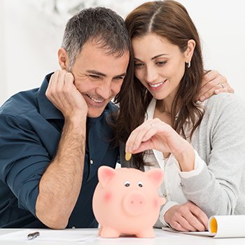 Family Saving In Piggy Bank